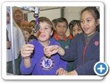 Visiting students play with year 6/7 exhibits