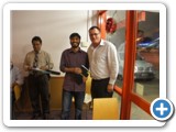 Mr Forde presents Dr Haneef with the Amnesty International annual report on human rights