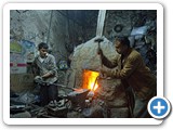 
Men work with a piece of metal in their shop in Ta'izz, or Taiz, a city in the Yemeni Highland.